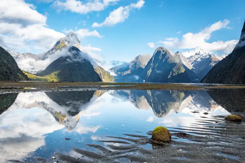 Mitre Peak reflected in the still waters of Milford Sound, New Zealand