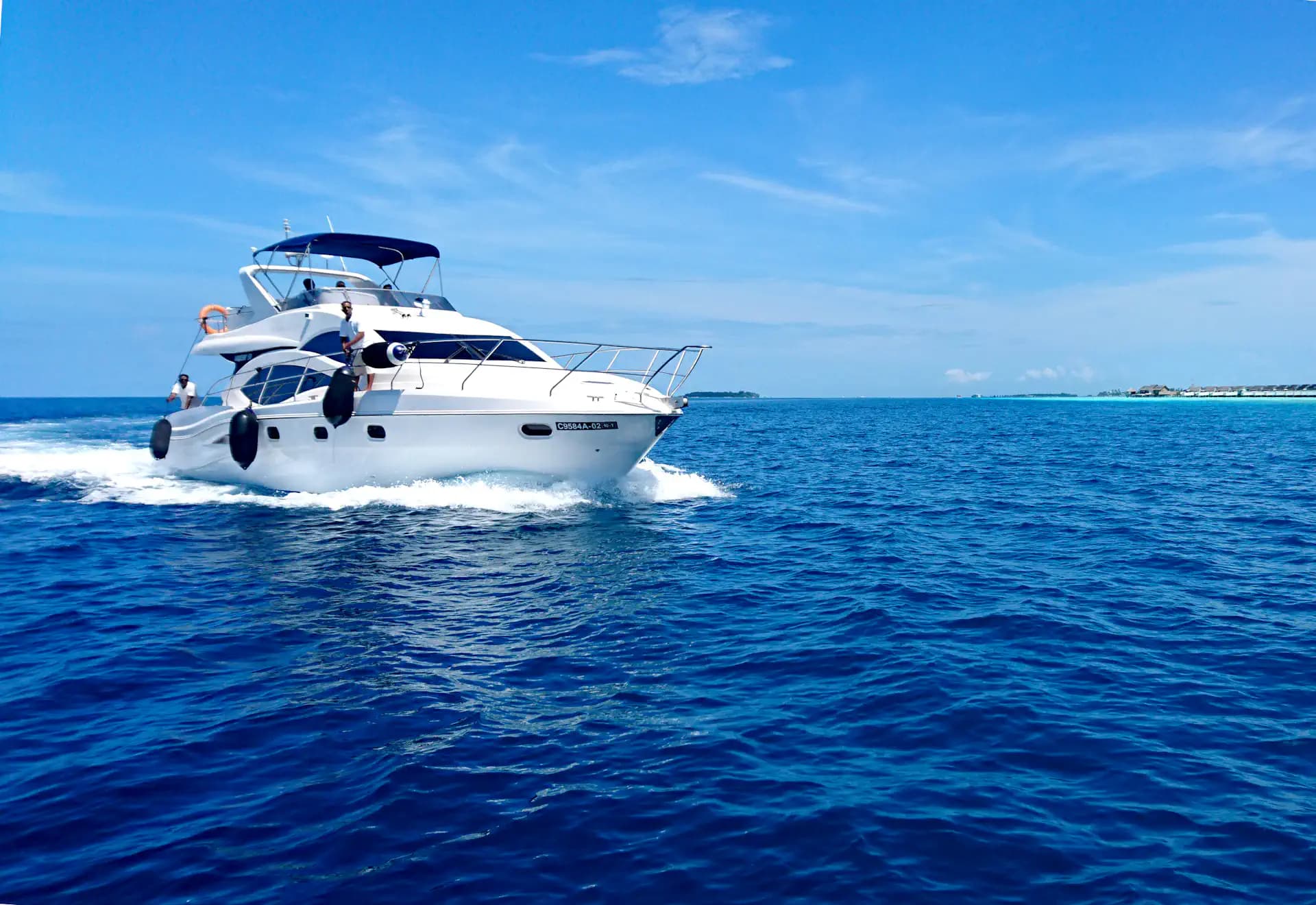 Traveler looking out over the ocean from a boat